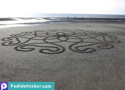 خالق آثار هنری بر روی شنهای ساحل